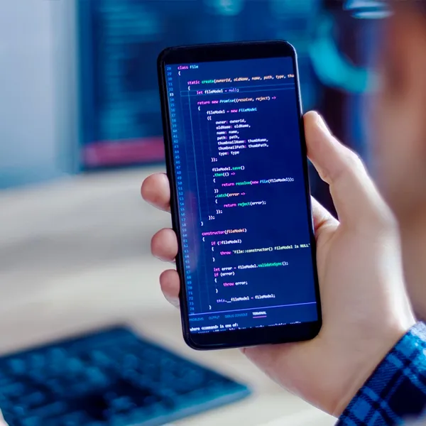 Developer reviewing application code on a smartphone